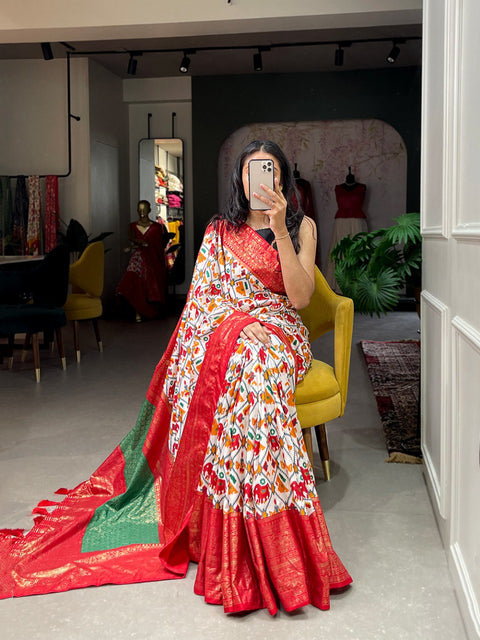 Red Dola silk sarees are known for their colourful diversity and geometric designs with patola print