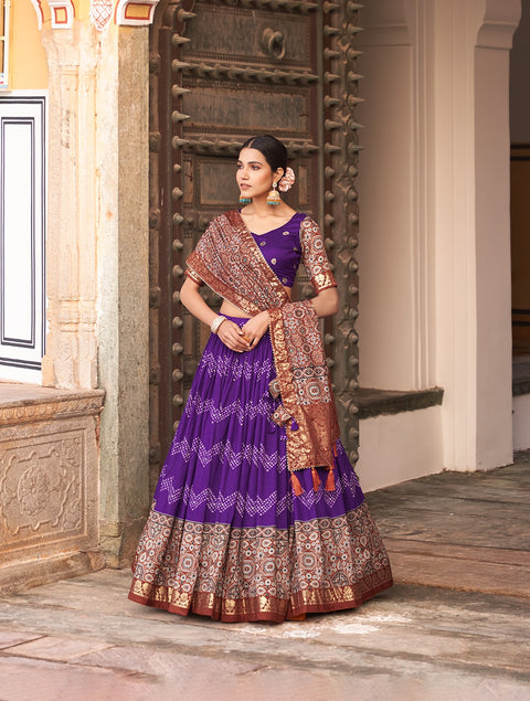 Purple In the embrace of Tusser silk, adorned with Ajarakh prints, the lehenga choli