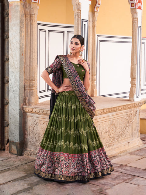 Green In the embrace of Tusser silk, adorned with Ajarakh prints, the lehenga choli