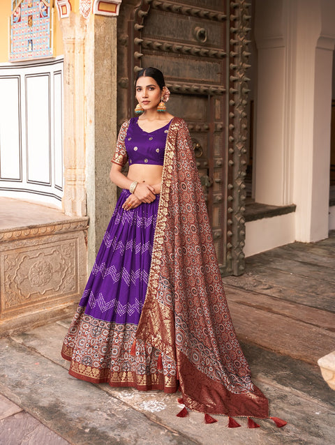 Purple In the embrace of Tusser silk, adorned with Ajarakh prints, the lehenga choli