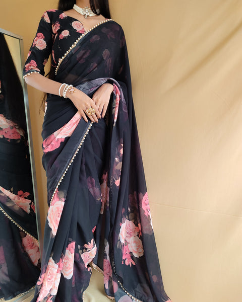 Black saree best way to represent your classy look with this spectacular georgette printed saree with Pearl lace border