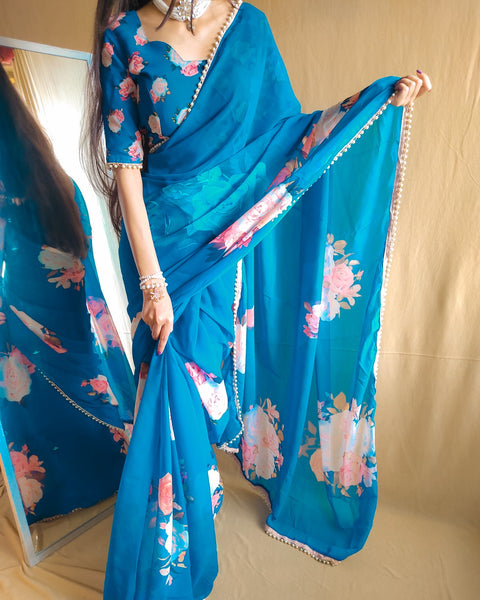 Blue saree best way to represent your classy look with this spectacular georgette printed saree with Pearl lace border