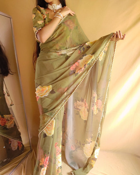 Green saree best way to represent your classy look with this spectacular georgette printed saree with Pearl lace border