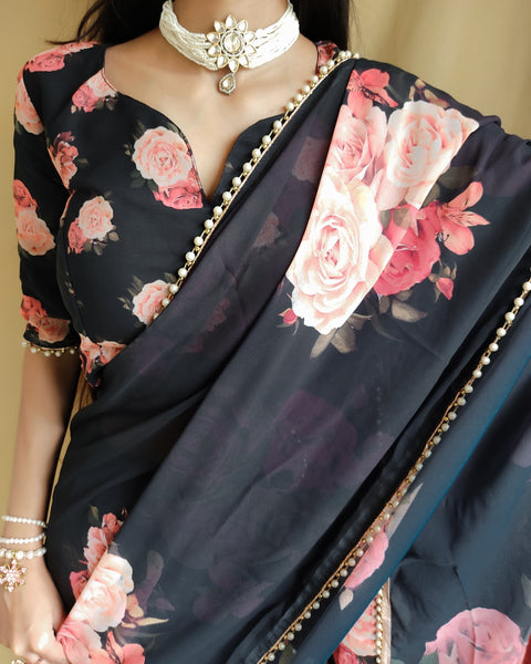 Black saree best way to represent your classy look with this spectacular georgette printed saree with Pearl lace border