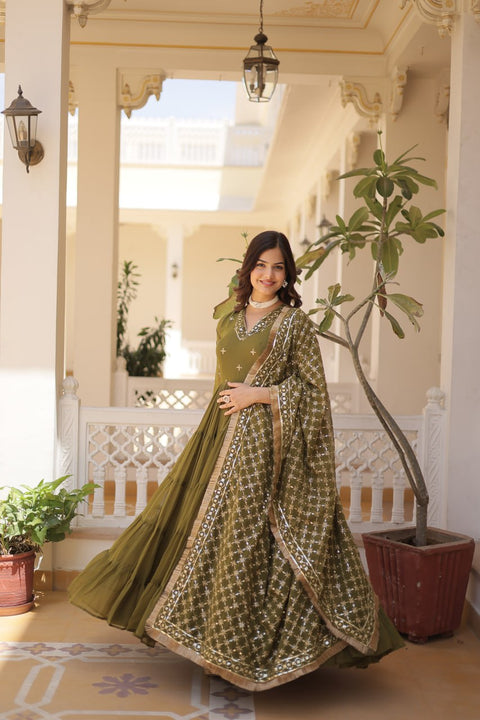 Green elegance of traditional attire with our Designer Festive Wear Gown For Woman