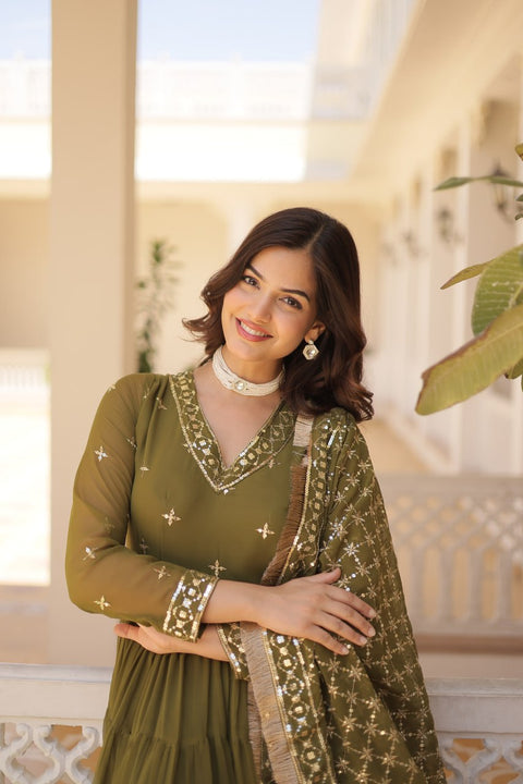 Green elegance of traditional attire with our Designer Festive Wear Gown For Woman