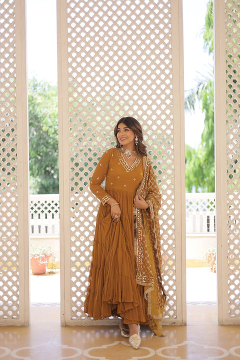 Yellow elegance of traditional attire with our Designer Festive Wear Gown For Woman