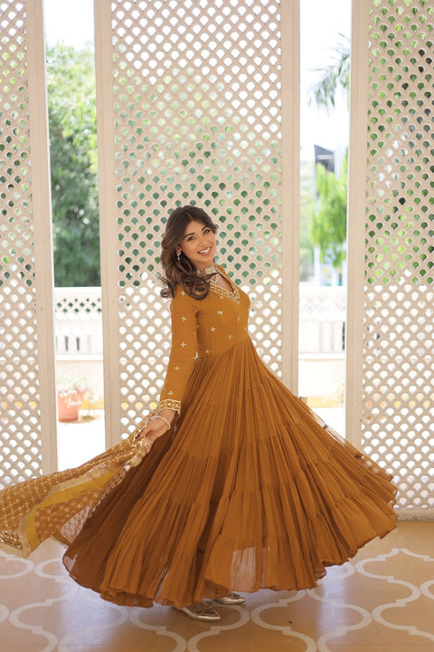 Yellow elegance of traditional attire with our Designer Festive Wear Gown For Woman