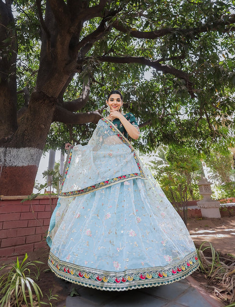 Glam and glow with ethnic beauty at the coming party by draping this colorful organza lehenga choli