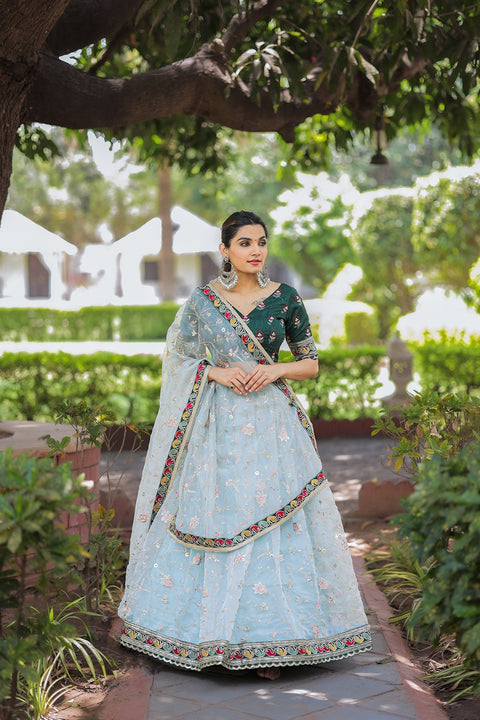 Glam and glow with ethnic beauty at the coming party by draping this colorful organza lehenga choli