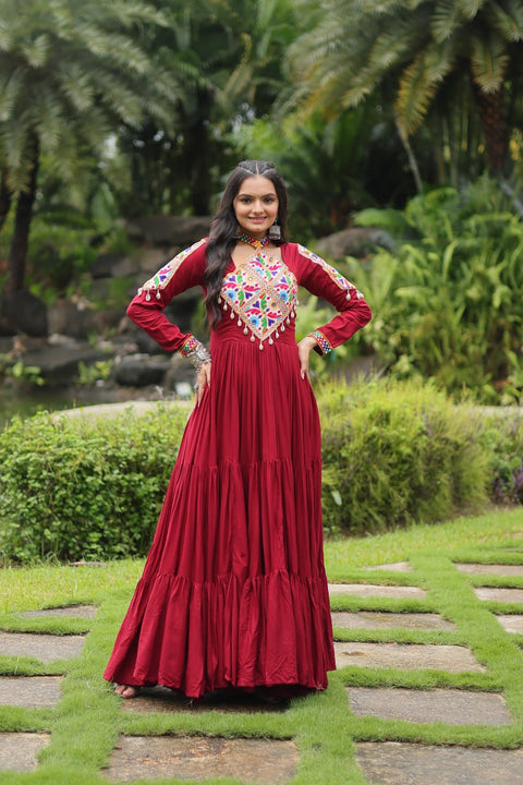 This Maroon Colored Attractive Partywear Gown will surely fetch you compliments for your rich sense of style