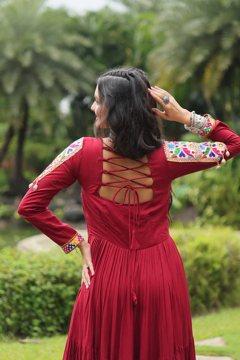 This Maroon Colored Attractive Partywear Gown will surely fetch you compliments for your rich sense of style