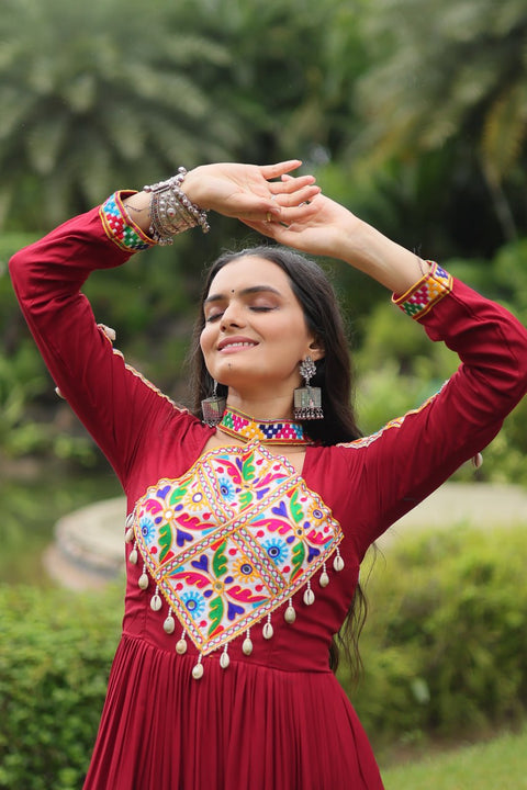 This Maroon Colored Attractive Partywear Gown will surely fetch you compliments for your rich sense of style