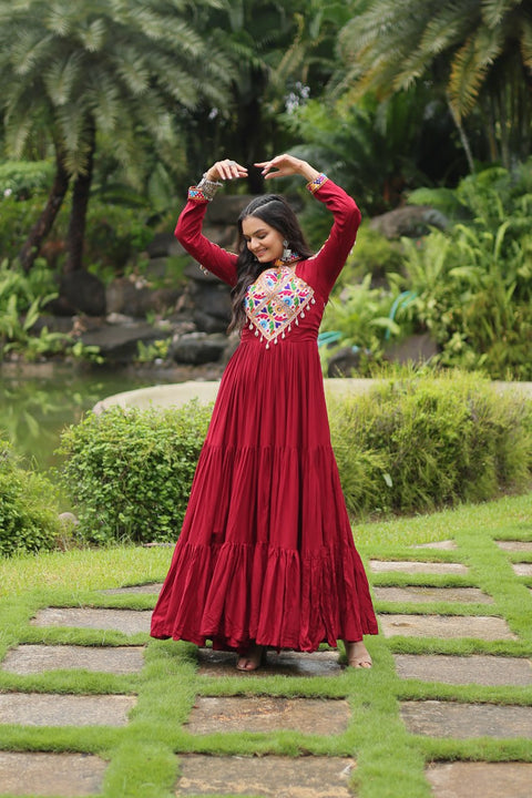 This Maroon Colored Attractive Partywear Gown will surely fetch you compliments for your rich sense of style