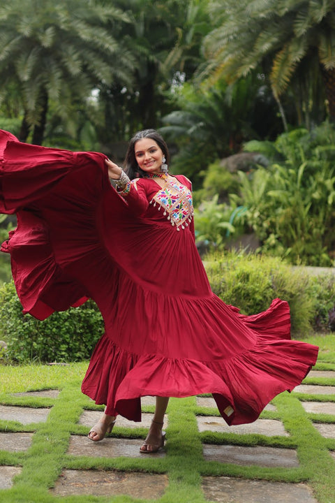 This Maroon Colored Attractive Partywear Gown will surely fetch you compliments for your rich sense of style