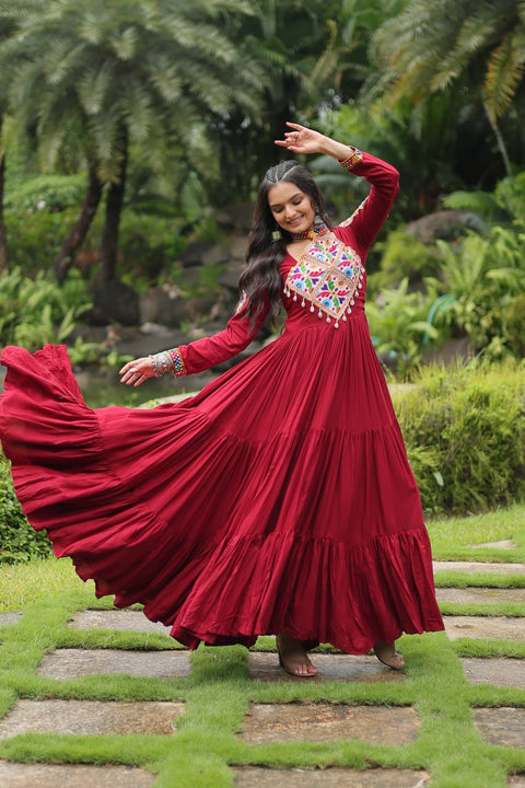 This Maroon Colored Attractive Partywear Gown will surely fetch you compliments for your rich sense of style