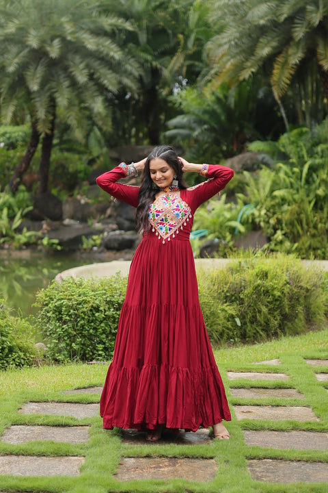 This Maroon Colored Attractive Partywear Gown will surely fetch you compliments for your rich sense of style