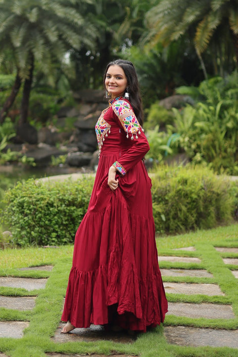 This Maroon Colored Attractive Partywear Gown will surely fetch you compliments for your rich sense of style