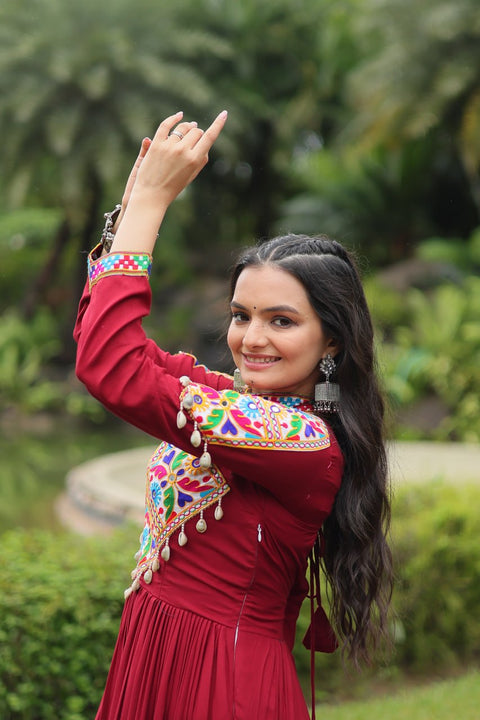 This Maroon Colored Attractive Partywear Gown will surely fetch you compliments for your rich sense of style