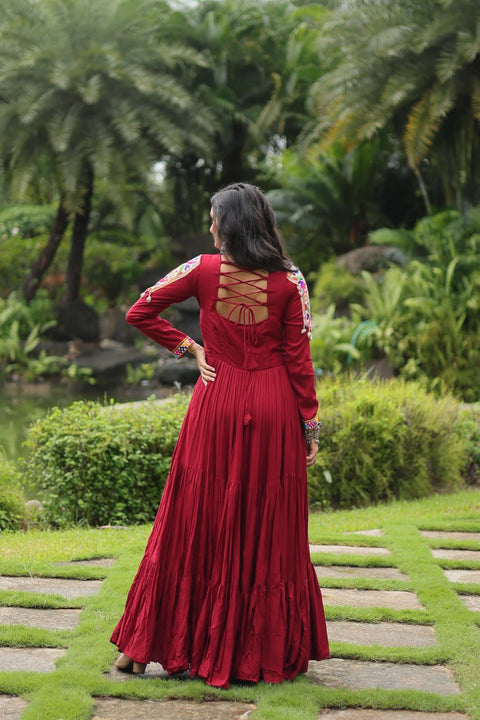 This Maroon Colored Attractive Partywear Gown will surely fetch you compliments for your rich sense of style