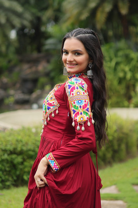 This Maroon Colored Attractive Partywear Gown will surely fetch you compliments for your rich sense of style