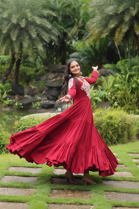 This Maroon Colored Attractive Partywear Gown will surely fetch you compliments for your rich sense of style