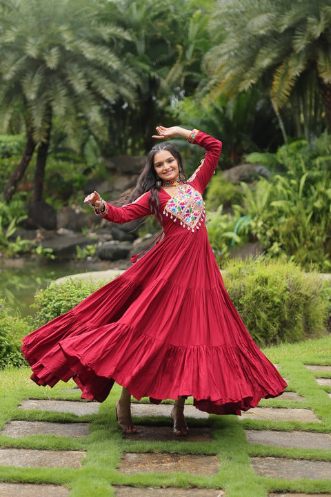 This Maroon Colored Attractive Partywear Gown will surely fetch you compliments for your rich sense of style