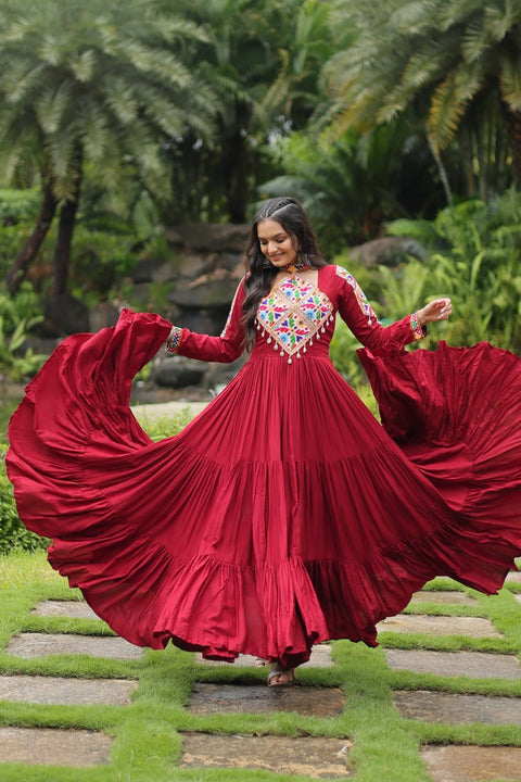 This Maroon Colored Attractive Partywear Gown will surely fetch you compliments for your rich sense of style