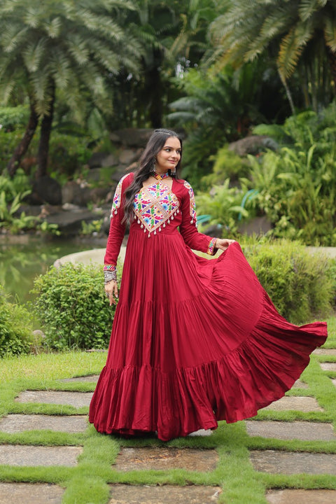 This Maroon Colored Attractive Partywear Gown will surely fetch you compliments for your rich sense of style