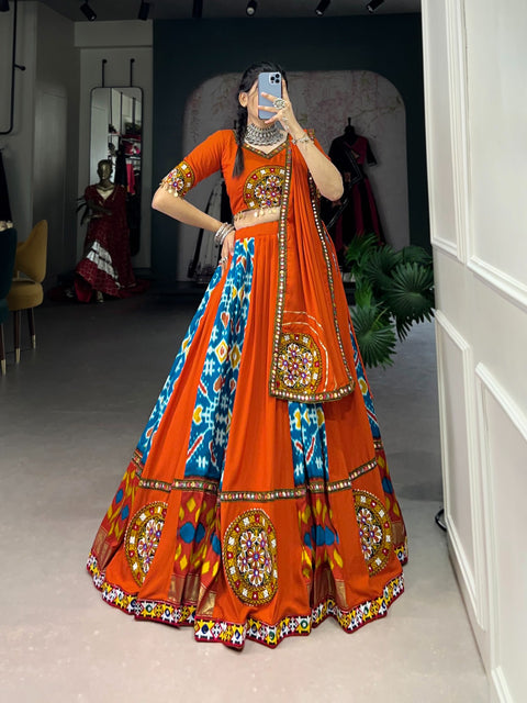 orange For your essential part of gujarati collection we are presenting navratri attire of rayon and silk lehenga