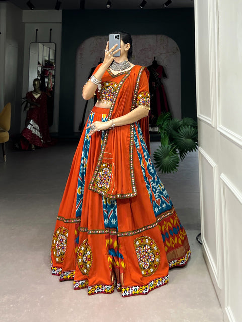 orange For your essential part of gujarati collection we are presenting navratri attire of rayon and silk lehenga