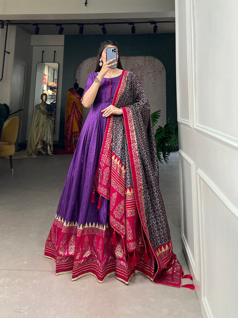 Purple the center of attention with this Tusser silk designer gown for women