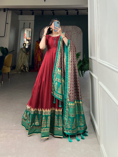 Red the center of attention with this Tusser silk designer gown for women