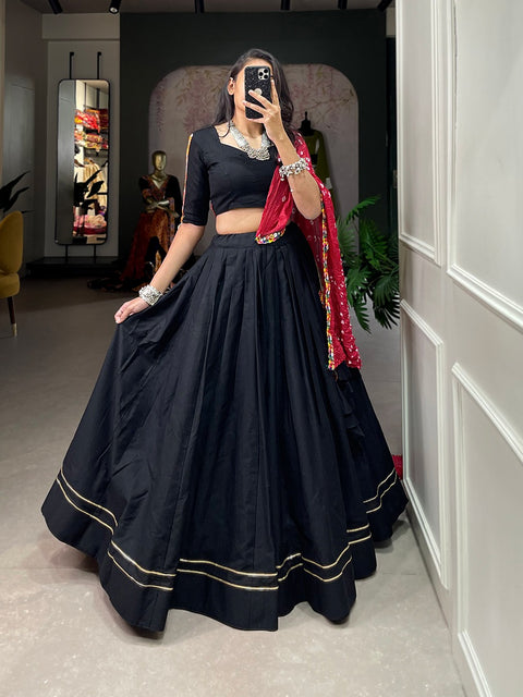 Give yourself quintessential look in navratri by wearing this  black classic lehenga choli crafted from the finest cotton, adorned with gamthi work blouse