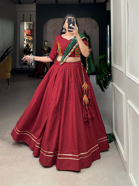 wearing this red classic lehenga choli crafted from the finest cotton, adorned with gamthi work blouse