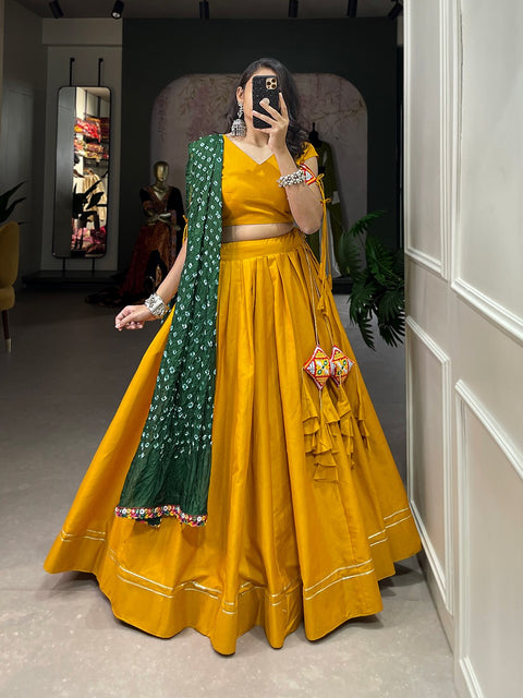 Yellow classic lehenga choli crafted from the finest cotton, adorned with gamthi work blouse