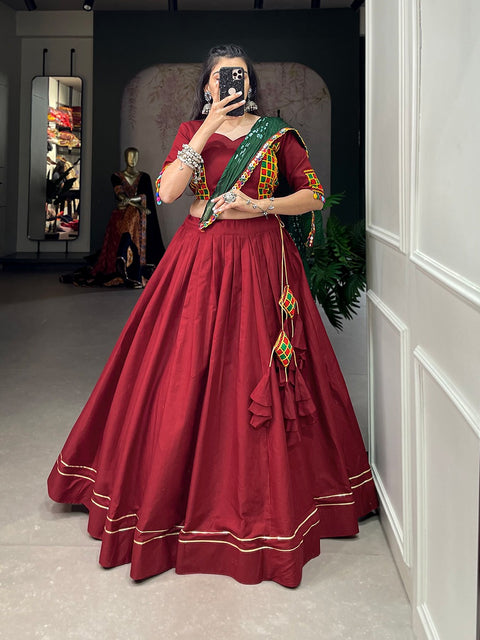 wearing this red classic lehenga choli crafted from the finest cotton, adorned with gamthi work blouse