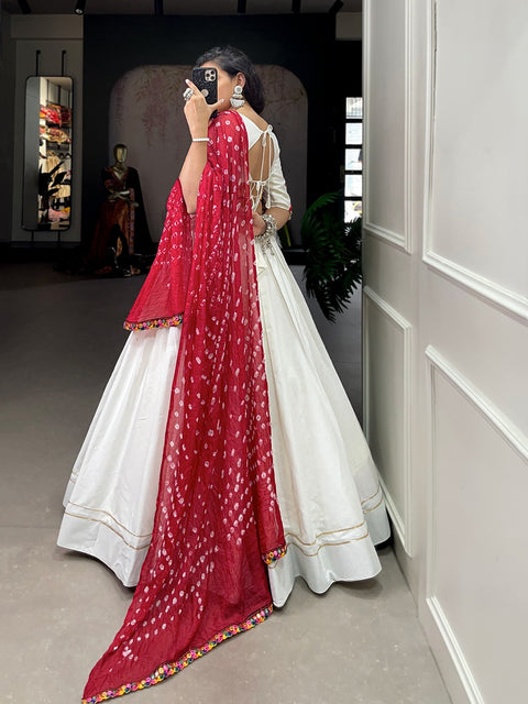 White classic lehenga choli crafted from the finest cotton, adorned with gamthi work blouse