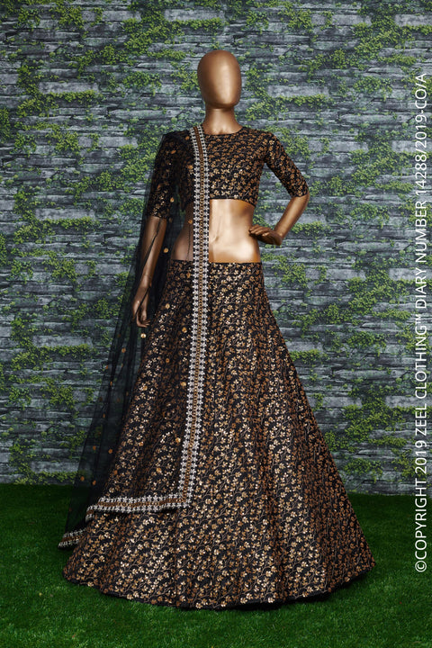 Featuring a black[color] Raw silk lehenga with golden zari embroidered in vine pattern accentuated with golden sequins all over lehenga choli for women