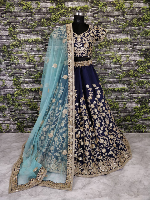 The Navy Blue Lehenga set is Adorned with Colourful Resham Embroidery on the Blouse and Lehenga for women.