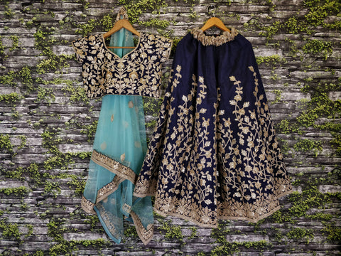 The Navy Blue Lehenga set is Adorned with Colourful Resham Embroidery on the Blouse and Lehenga for women.