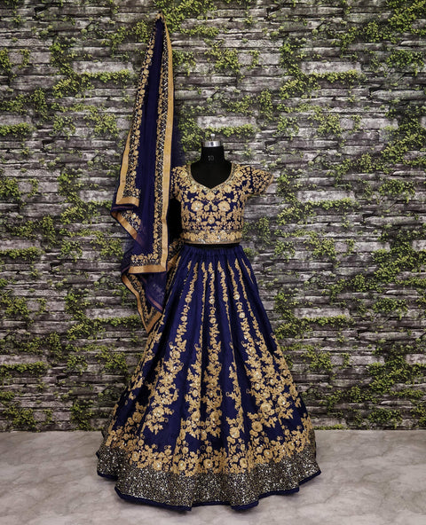 Give yourself an unique look by wearing this exquisite navy blue color silk lehenga set.