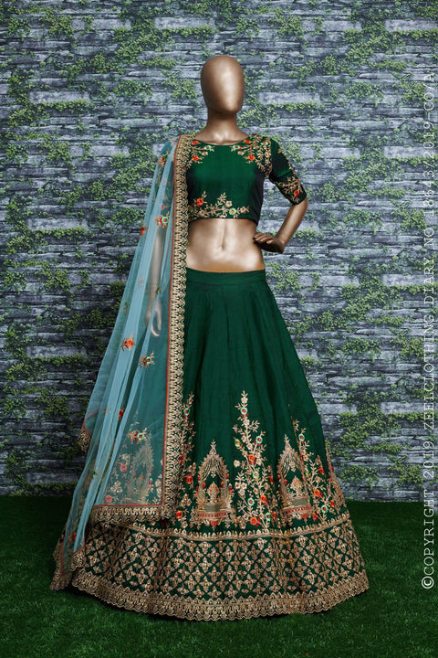 lehenga is prepared on a taffeta satin silk base in an eye-pleasing shade of dark green for women