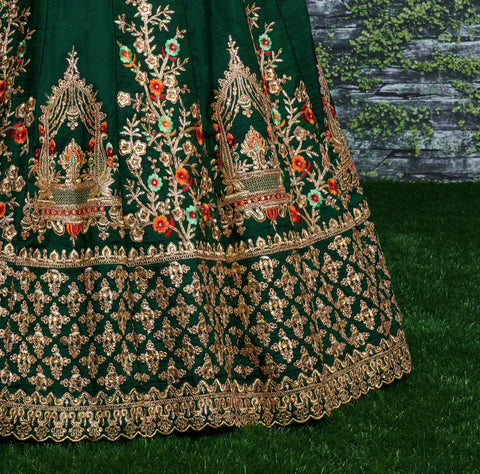 lehenga is prepared on a taffeta satin silk base in an eye-pleasing shade of dark green for women