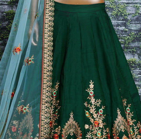 lehenga is prepared on a taffeta satin silk base in an eye-pleasing shade of dark green for women