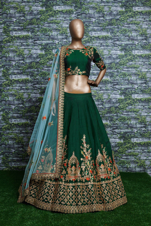 lehenga is prepared on a taffeta satin silk base in an eye-pleasing shade of dark green for women