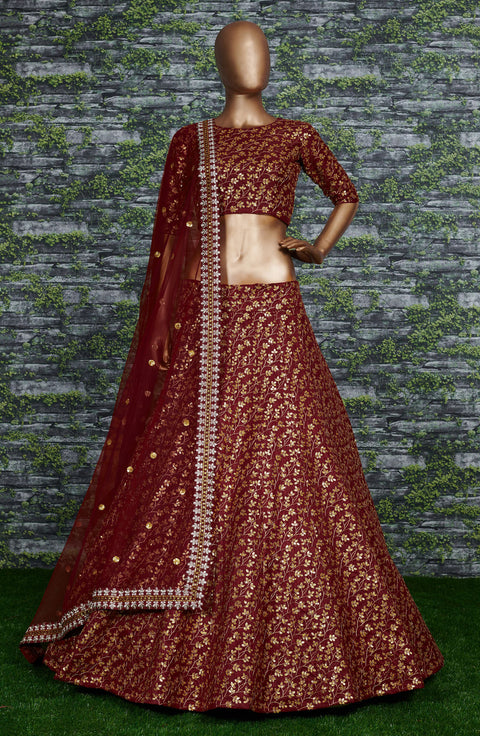 maroon Raw silk lehenga with golden zari embroidered in vine pattern accentuated with golden sequins all over lehenga choli for women