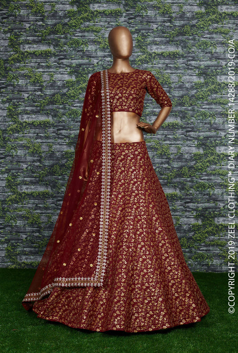 maroon Raw silk lehenga with golden zari embroidered in vine pattern accentuated with golden sequins all over lehenga choli for women