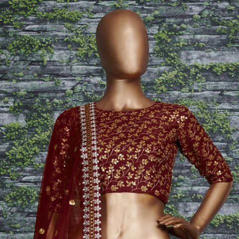 maroon Raw silk lehenga with golden zari embroidered in vine pattern accentuated with golden sequins all over lehenga choli for women