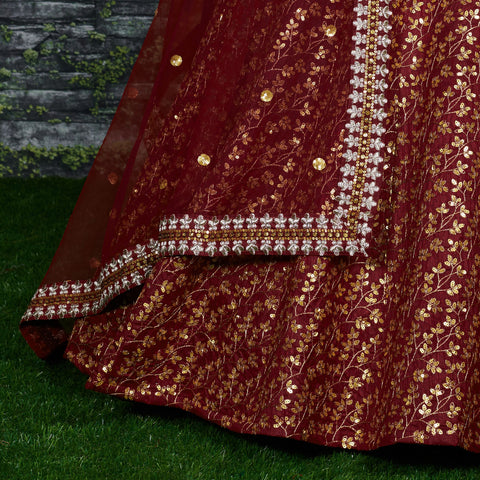 maroon Raw silk lehenga with golden zari embroidered in vine pattern accentuated with golden sequins all over lehenga choli for women